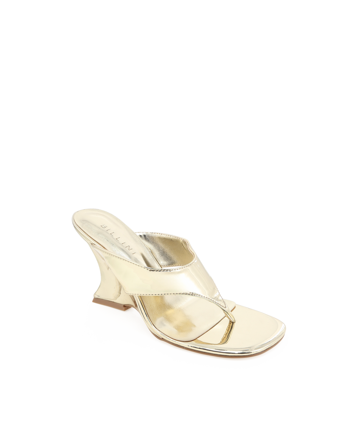 a gold high heeled shoe