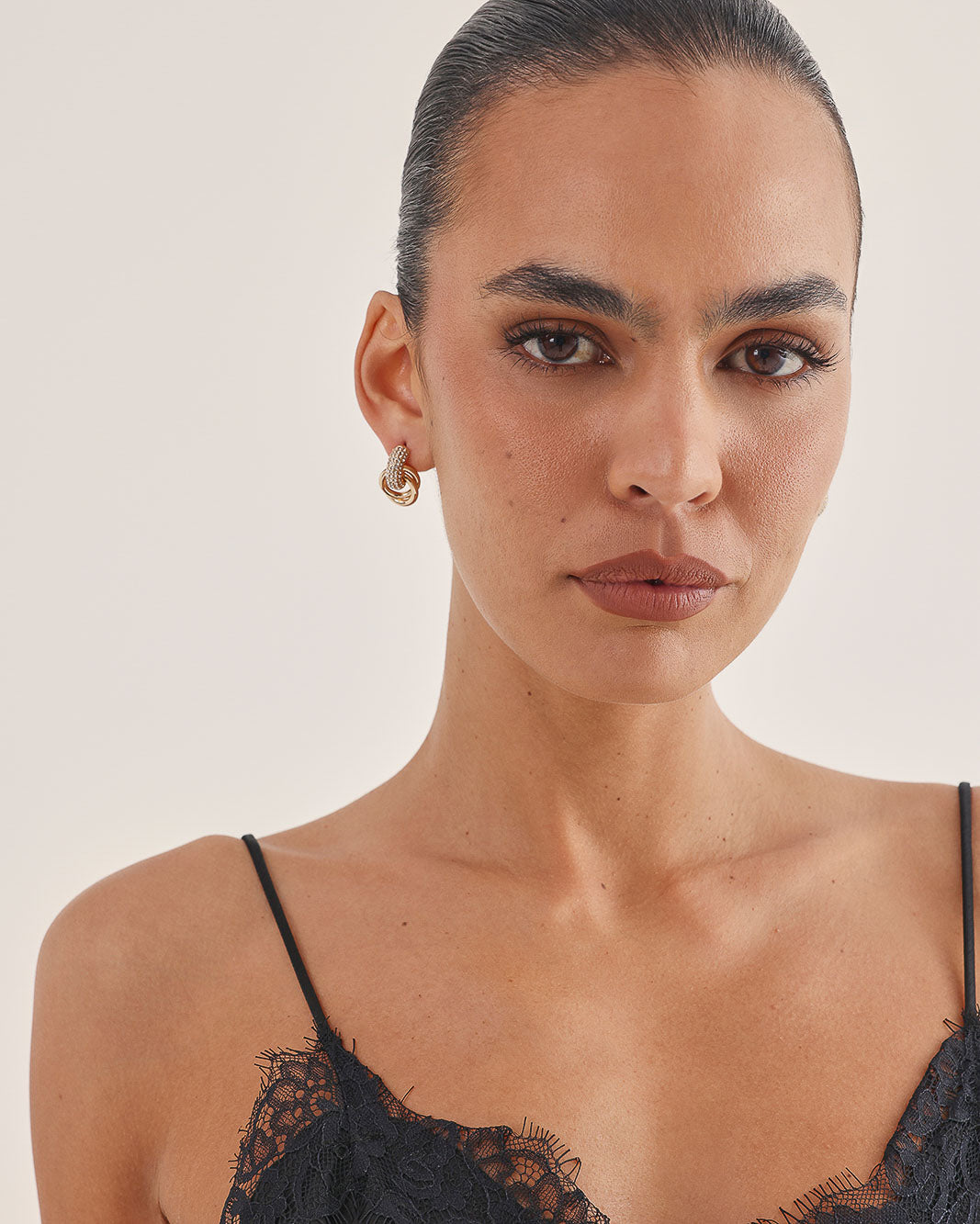 a woman with short hair and freckles