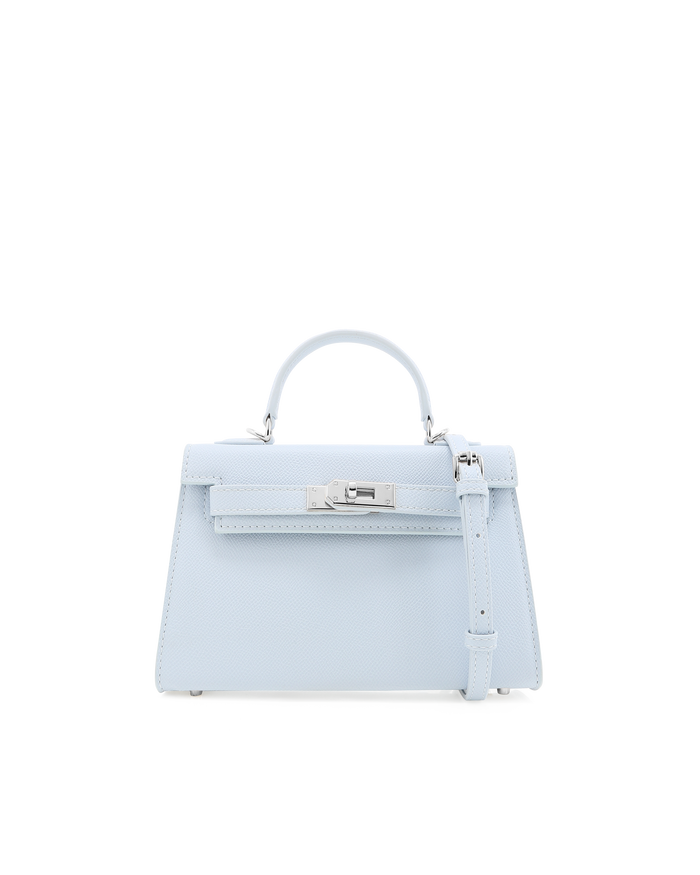 a light blue handbag with a silver handle