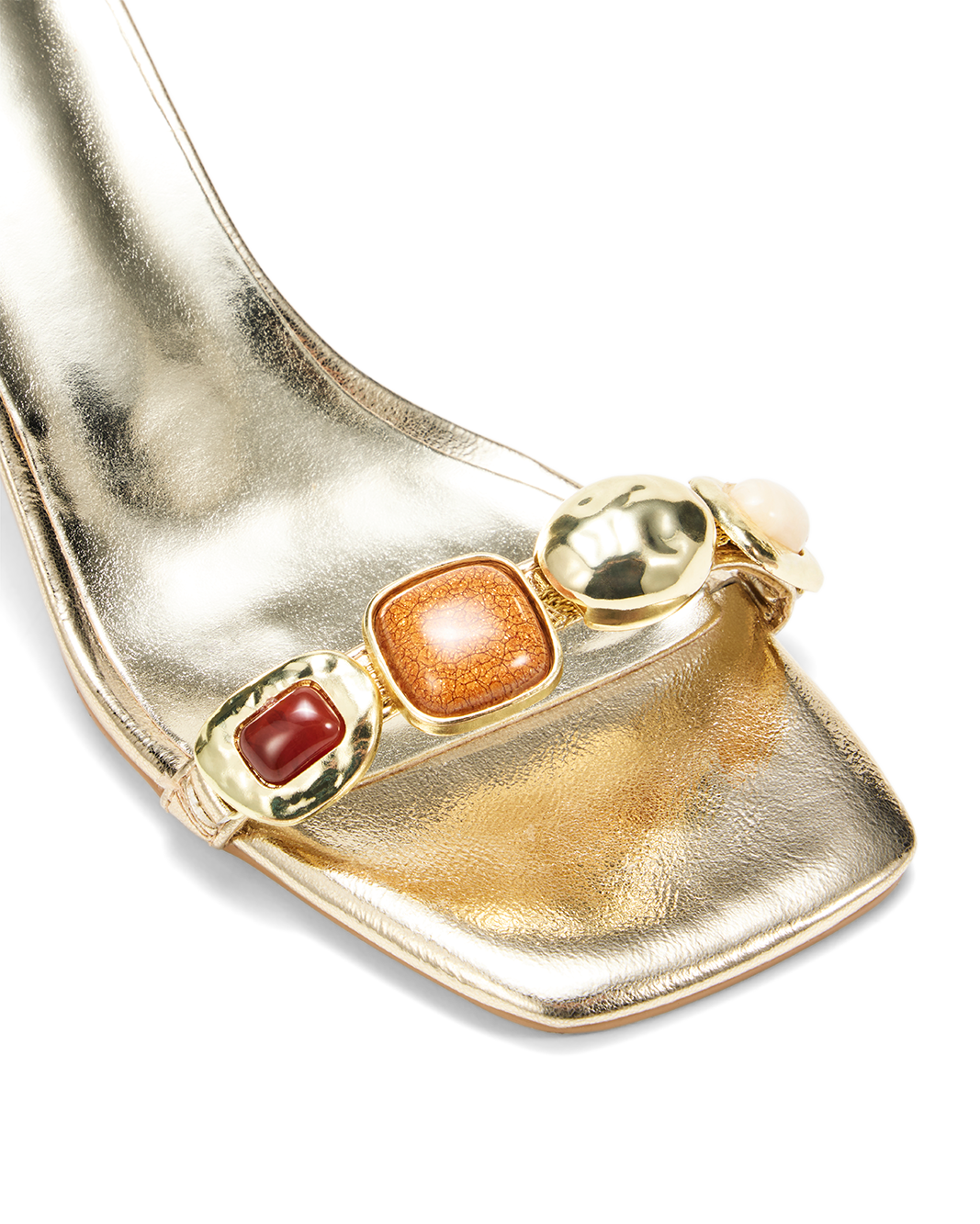 a close up of a gold shoe