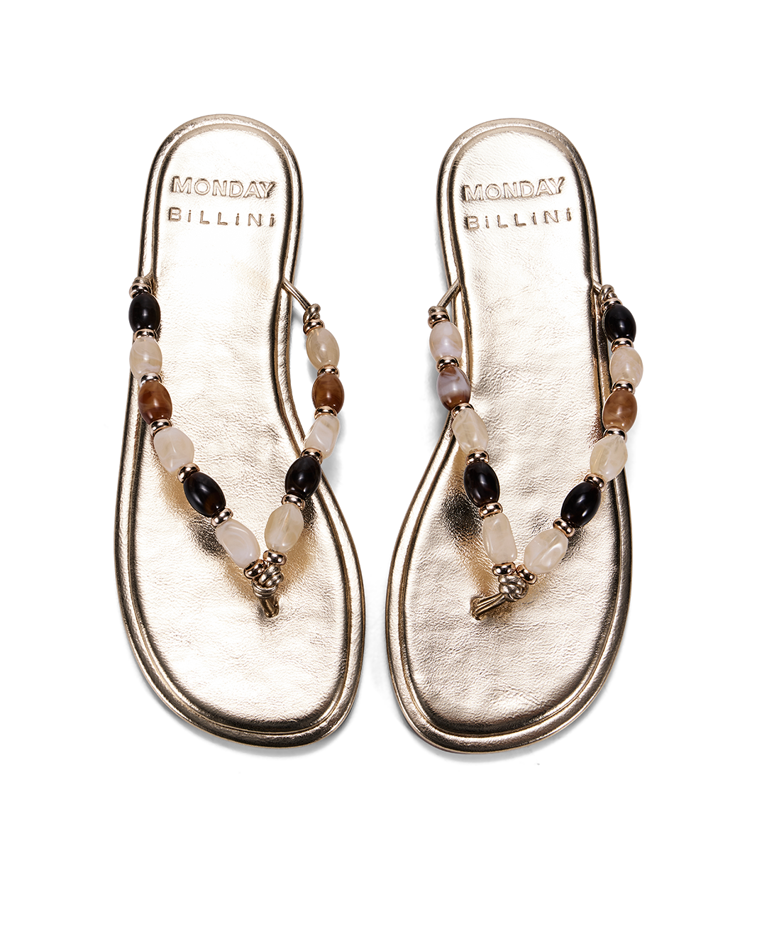 a pair of gold sandals with beads