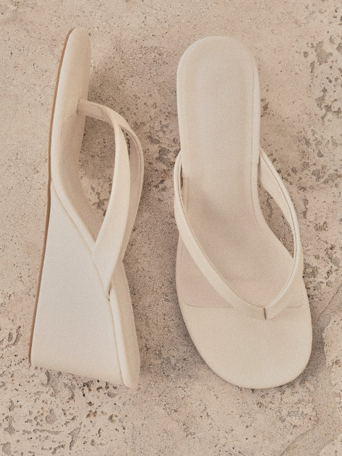 a pair of white sandals